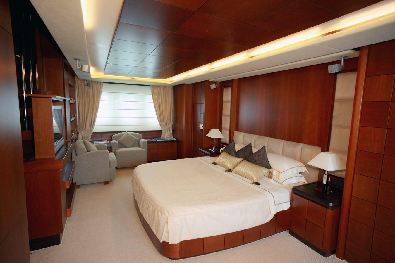 a hotel room with a bed and a tv aboard HYE SEAS II Yacht for Sale