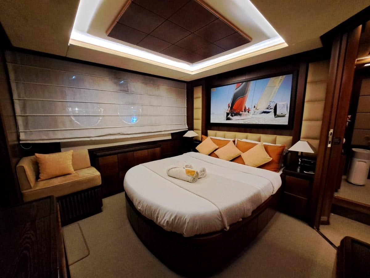 a hotel room with a bed and a couch aboard HYE SEAS II Yacht for Sale
