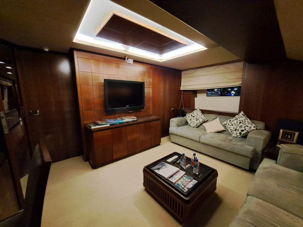 a living room with a couch and a tv aboard HYE SEAS II Yacht for Sale