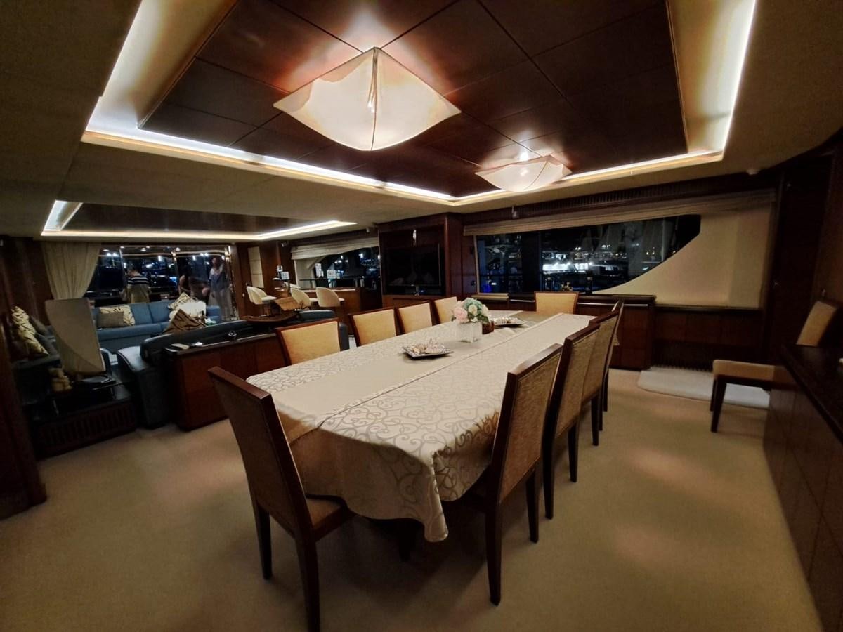 a large dining table in a restaurant aboard HYE SEAS II Yacht for Sale