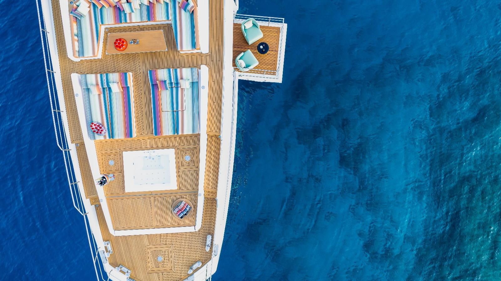 a wooden shelf with books on it aboard AFRICA ONE Yacht for Sale