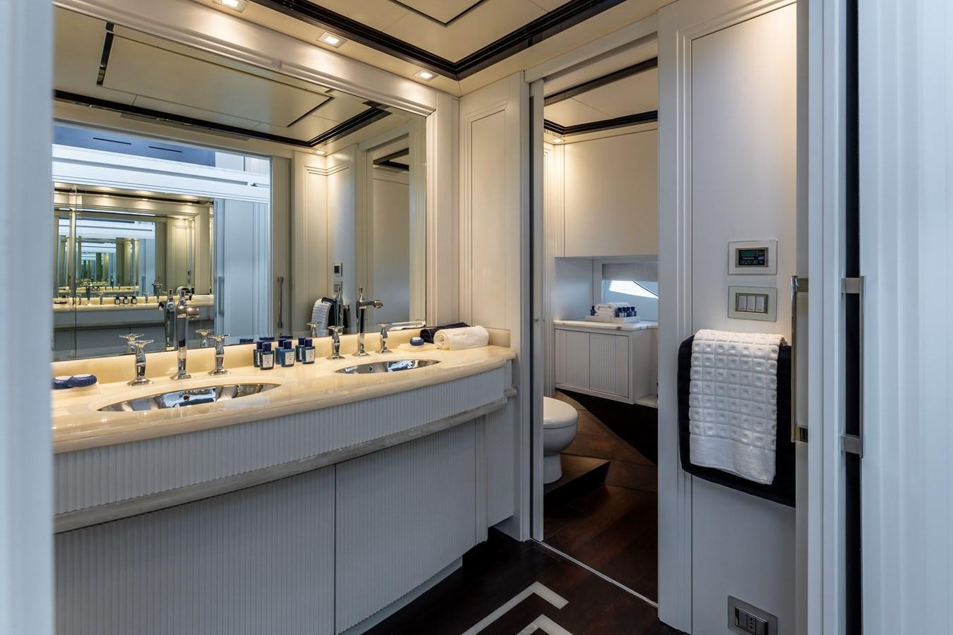 a bathroom with a large mirror aboard DOMUS Yacht for Sale