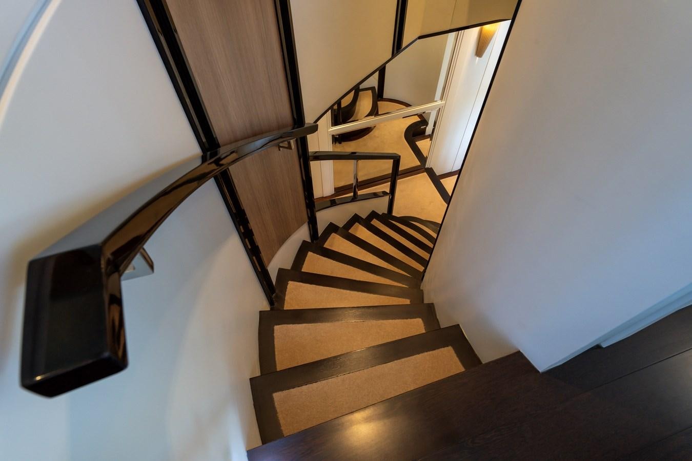 a staircase with a railing aboard DOMUS Yacht for Sale