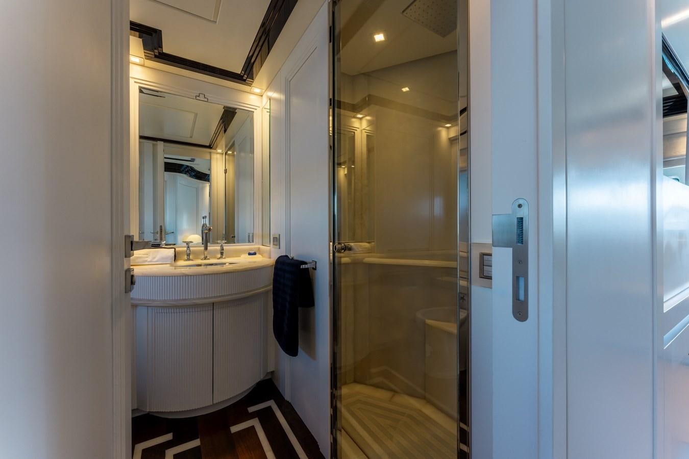 a bathroom with a sink and a mirror aboard DOMUS Yacht for Sale