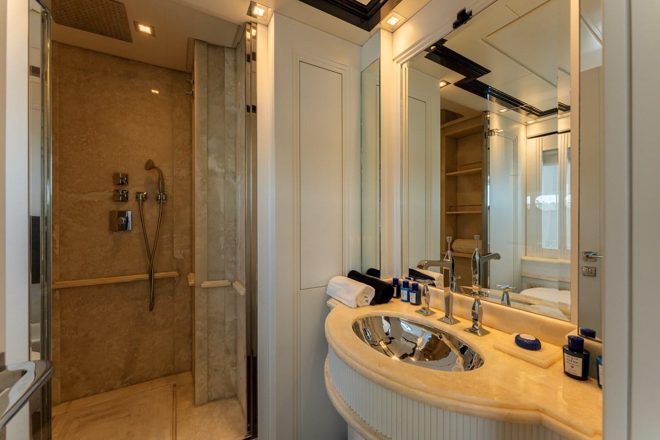 a bathroom with a sink and a shower aboard DOMUS Yacht for Sale