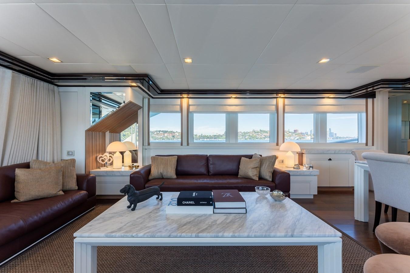 a living room with a large rug aboard DOMUS Yacht for Sale