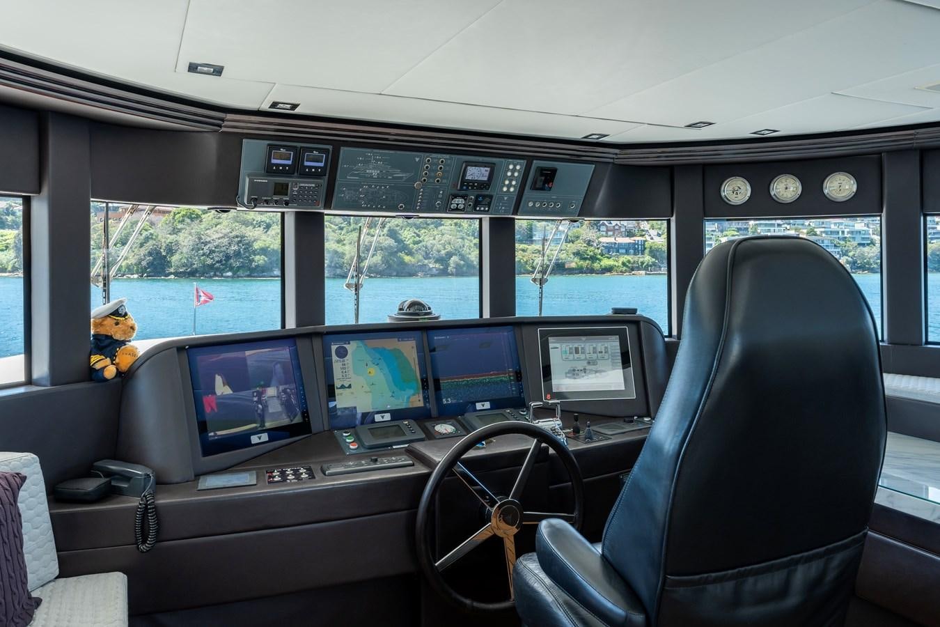 inside of a car with many monitors and screens aboard DOMUS Yacht for Sale