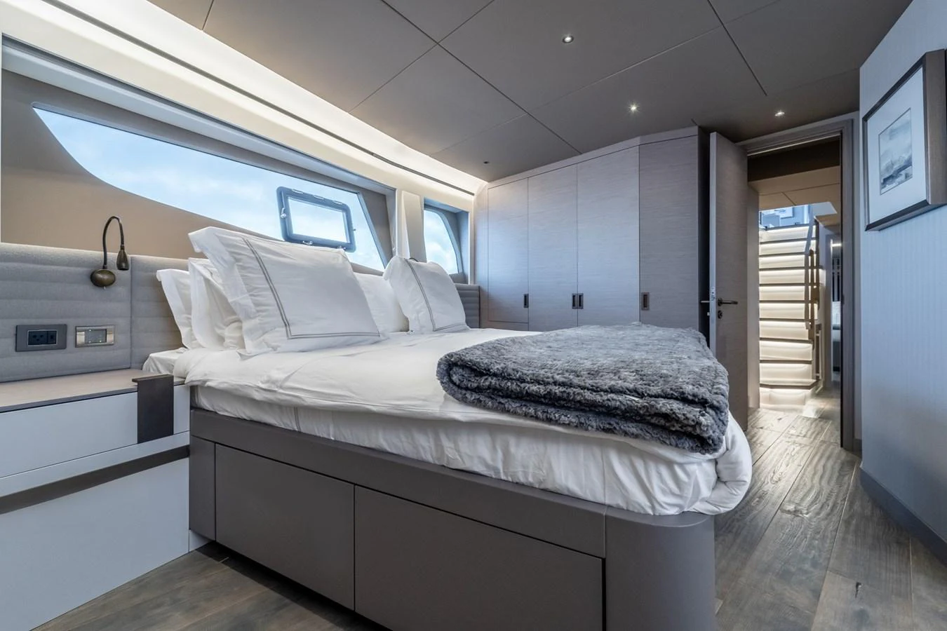 a room with a bed and a door aboard EXIT STRATEGY Yacht for Sale