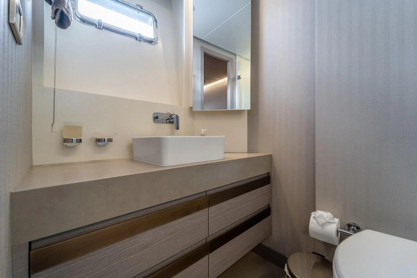 a bathroom with a sink and a toilet aboard EXIT STRATEGY Yacht for Sale