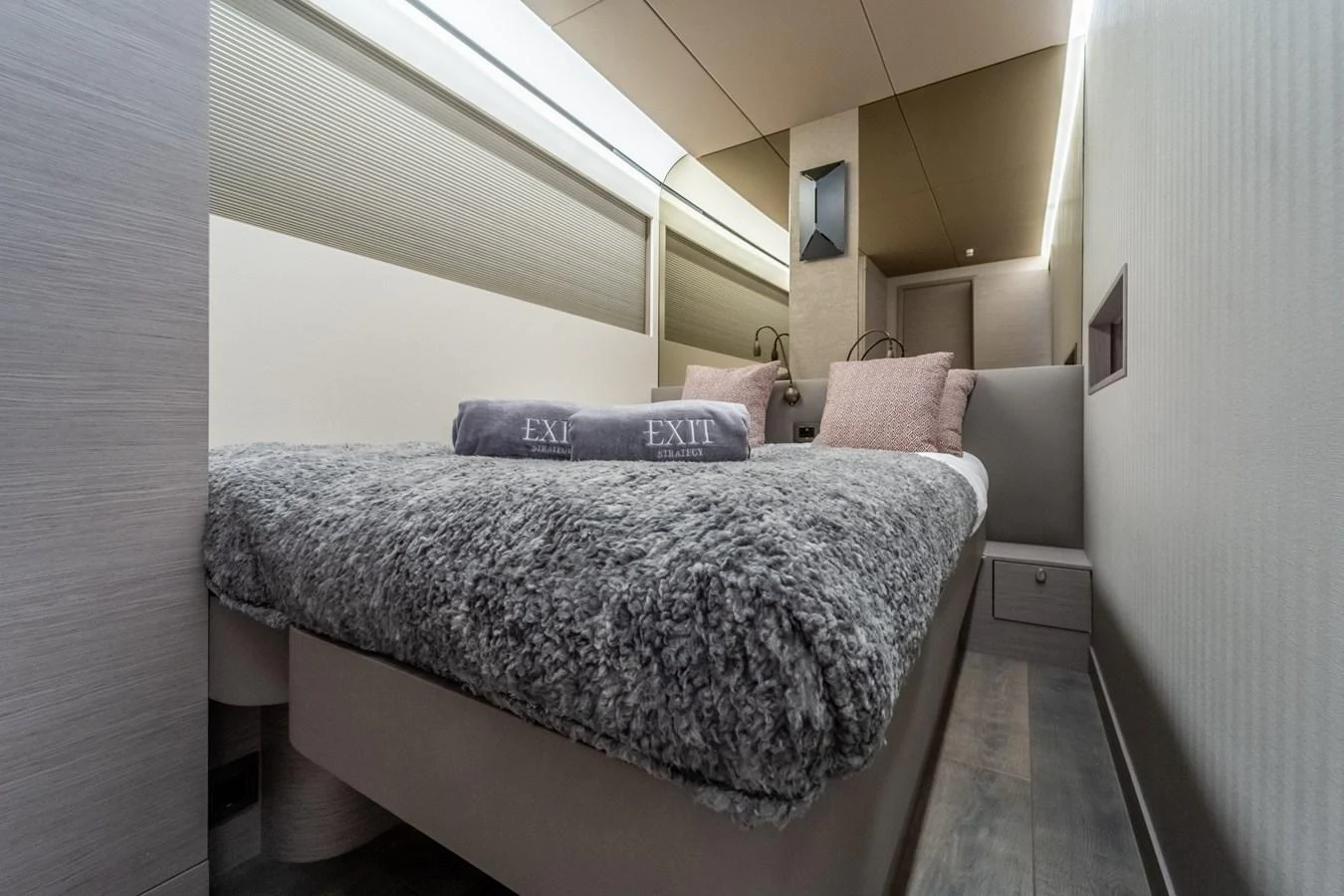 a bed with a white sheet aboard EXIT STRATEGY Yacht for Sale