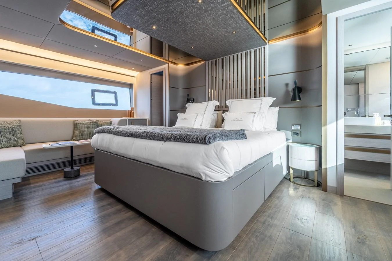 a room with a bed and a couch aboard EXIT STRATEGY Yacht for Sale