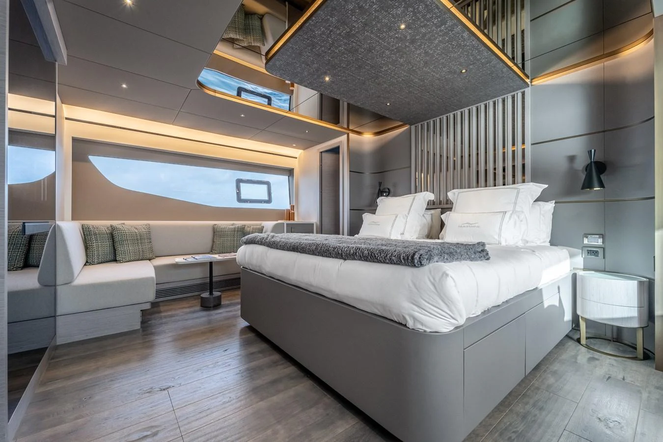 a room with a bed and a couch aboard EXIT STRATEGY Yacht for Sale