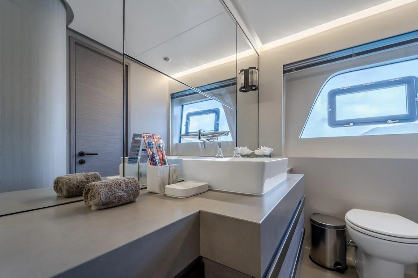 a bathroom with a large mirror aboard EXIT STRATEGY Yacht for Sale