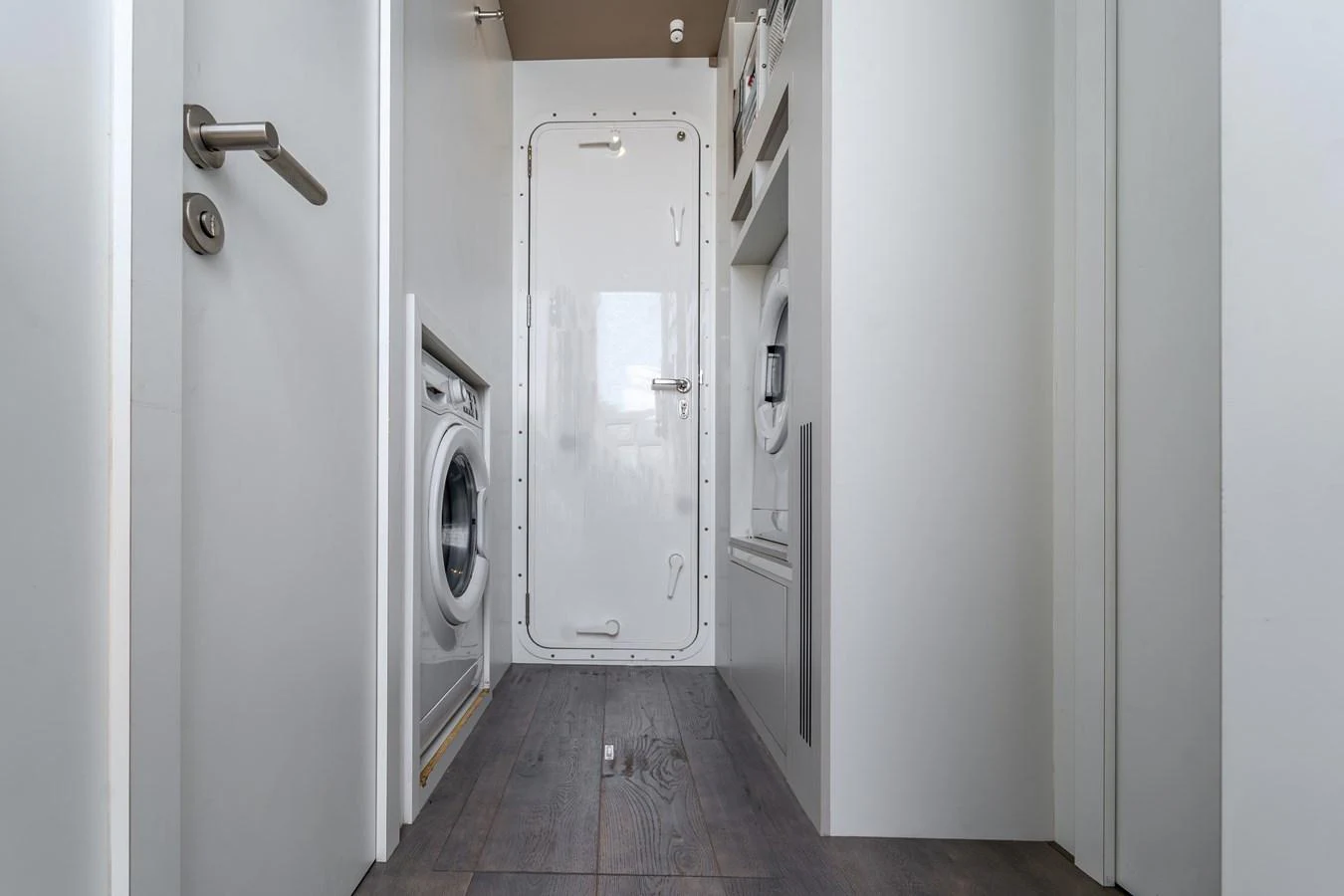 a white door with a handle aboard EXIT STRATEGY Yacht for Sale