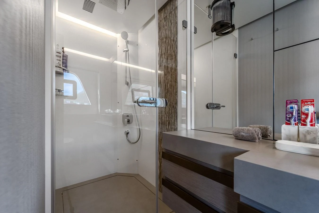 a bathroom with a shower and a sink aboard EXIT STRATEGY Yacht for Sale
