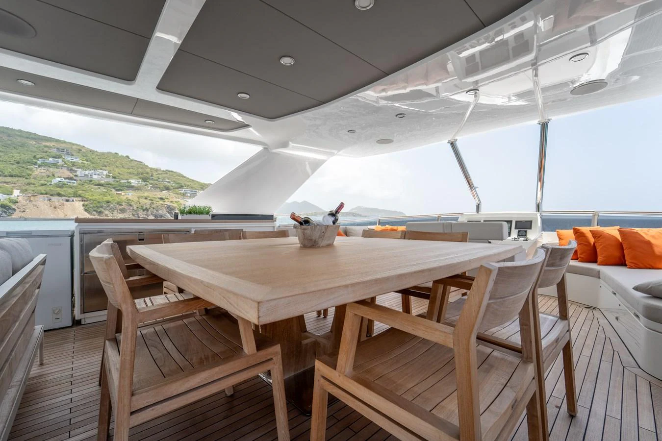 a table with chairs and a large window aboard EXIT STRATEGY Yacht for Sale