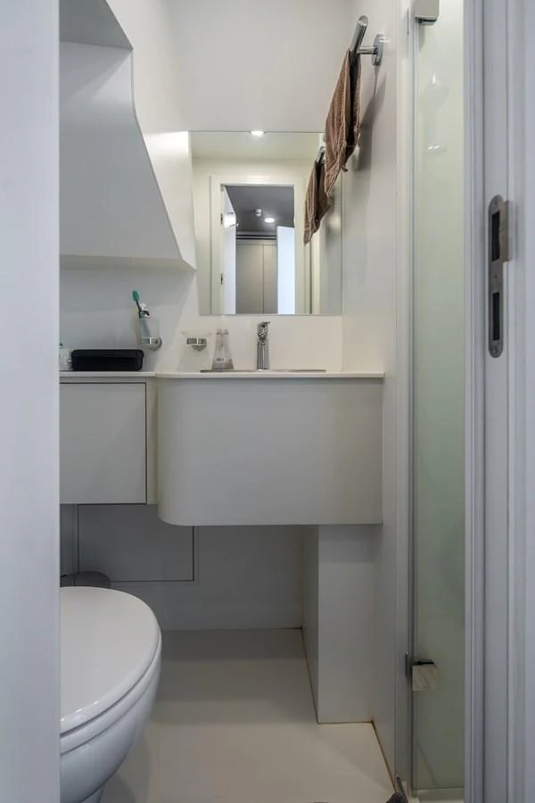 a bathroom with a sink and a toilet aboard EXIT STRATEGY Yacht for Sale