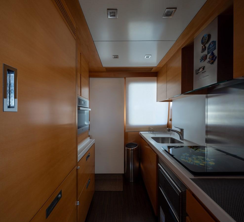 a kitchen with a stainless steel oven aboard ANTALYA Yacht for Sale