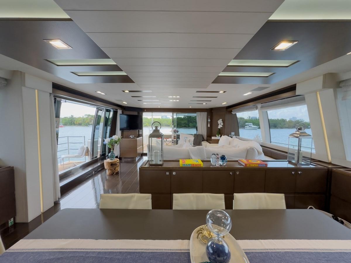 a room with a large window and a desk with a lamp on it aboard WHITE PEARL Yacht for Sale