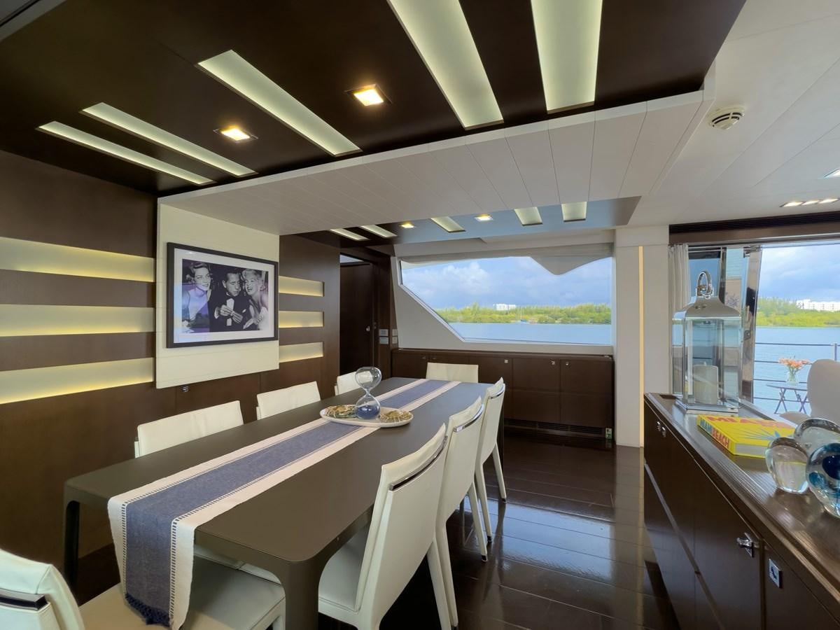 a room with a table and chairs aboard WHITE PEARL Yacht for Sale