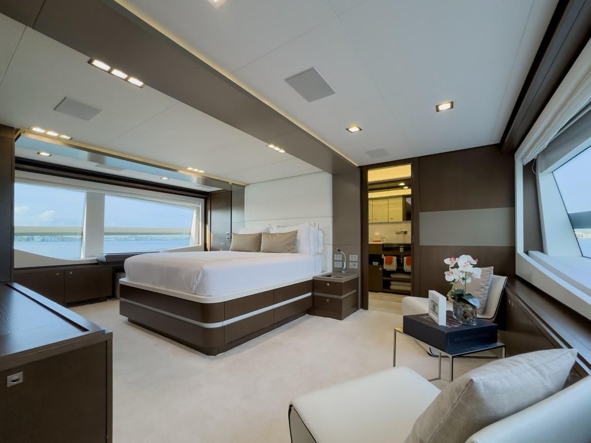 a bedroom with a large bed aboard WHITE PEARL Yacht for Sale