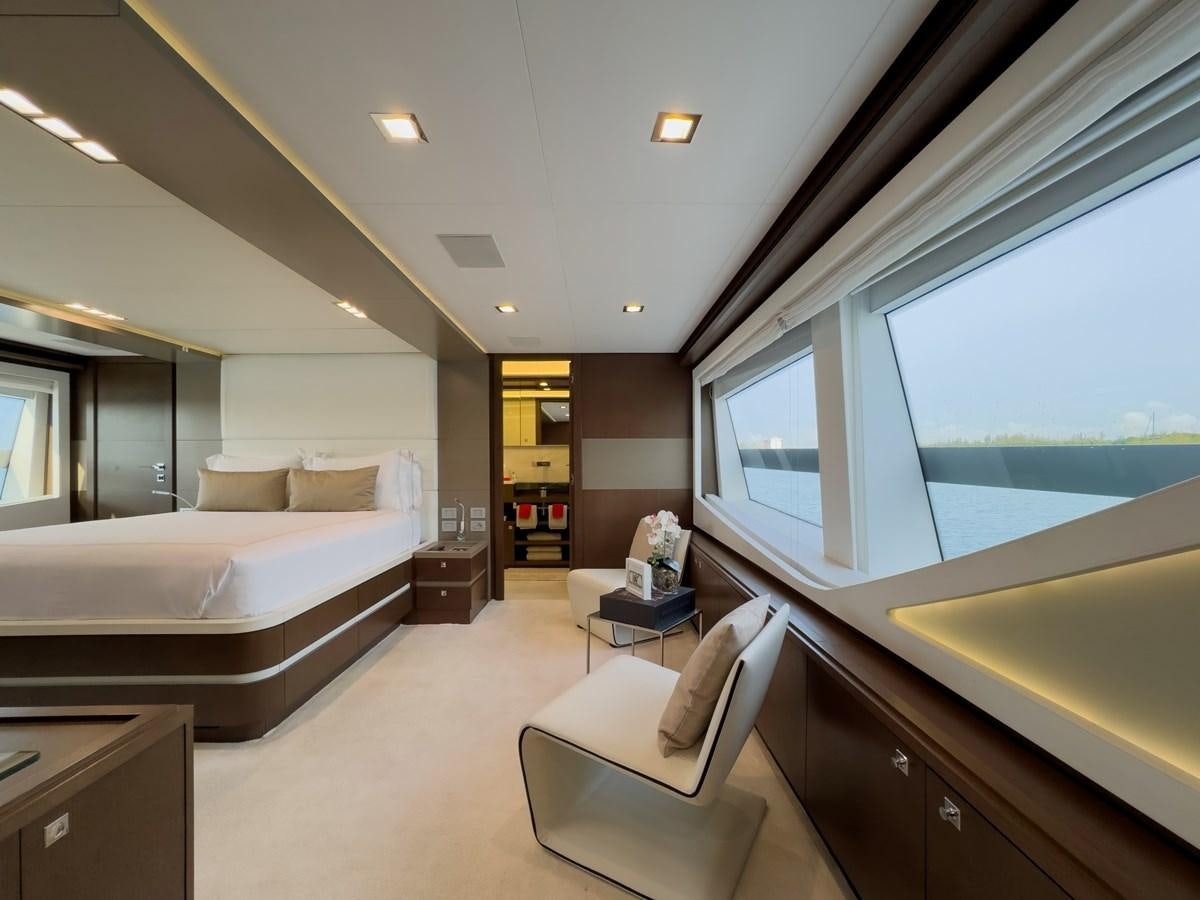 a room with a bed and a window aboard WHITE PEARL Yacht for Sale