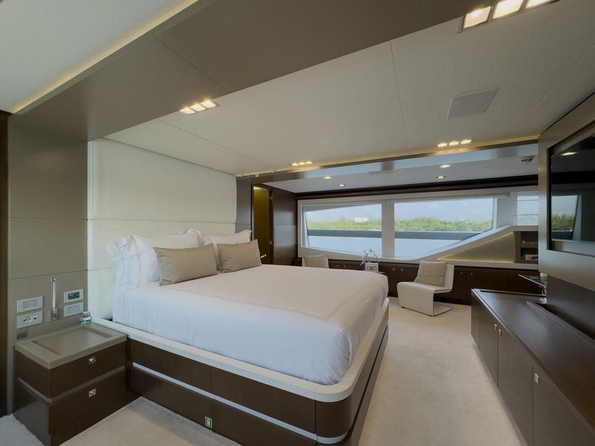 a room with a bed and a view of the water aboard WHITE PEARL Yacht for Sale