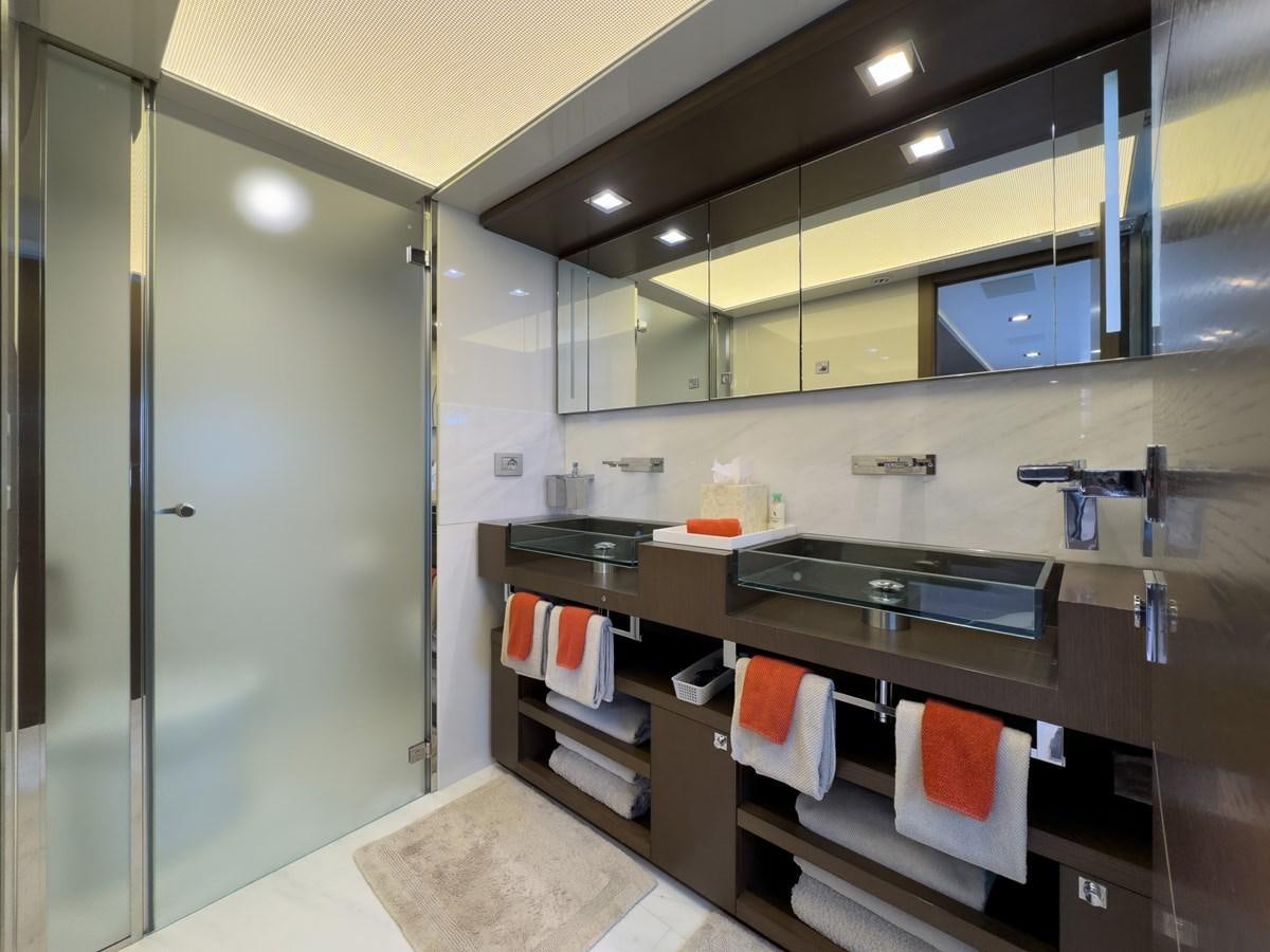 a bathroom with a large mirror aboard WHITE PEARL Yacht for Sale