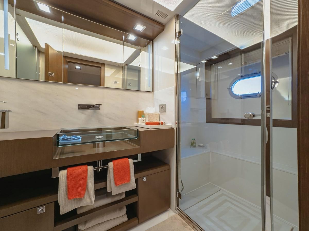 a bathroom with a sink and a mirror aboard WHITE PEARL Yacht for Sale