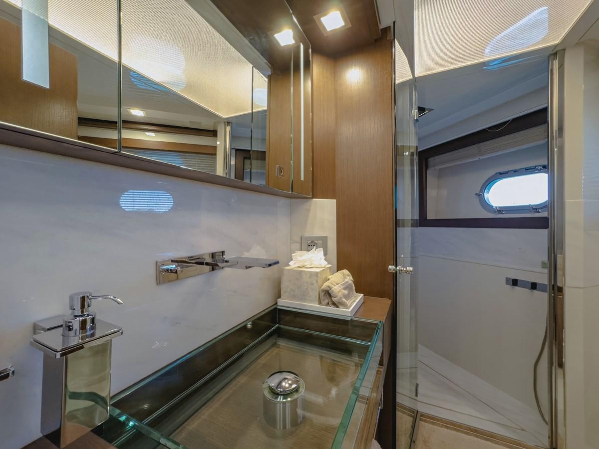 a bathroom with a countertop sink and a mirror aboard WHITE PEARL Yacht for Sale