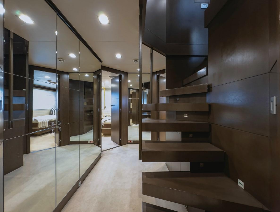 a room with wooden stairs aboard WHITE PEARL Yacht for Sale