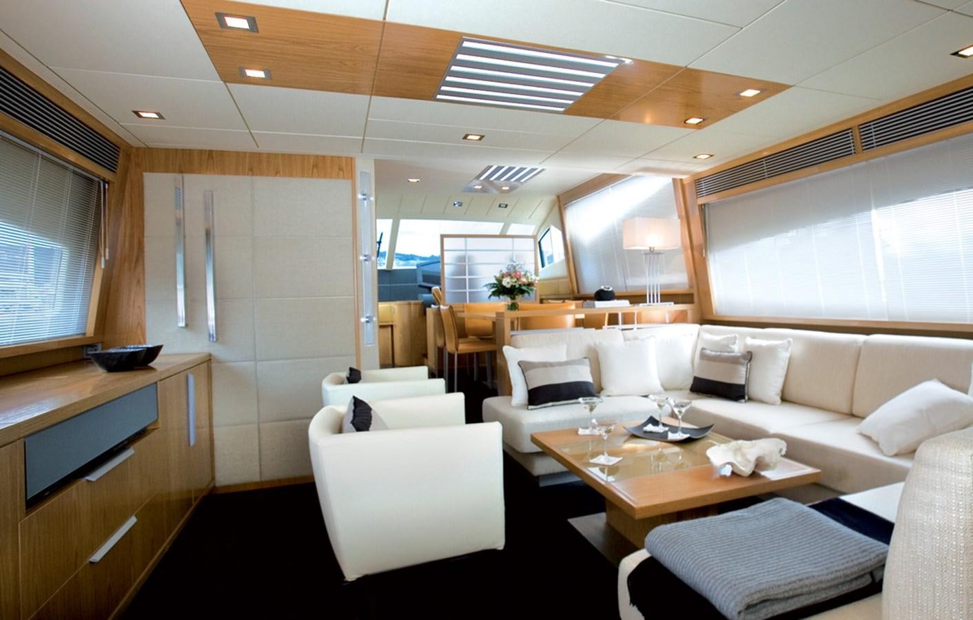 a room with a couch and a table aboard RODMAN 74 MUSE Yacht for Sale