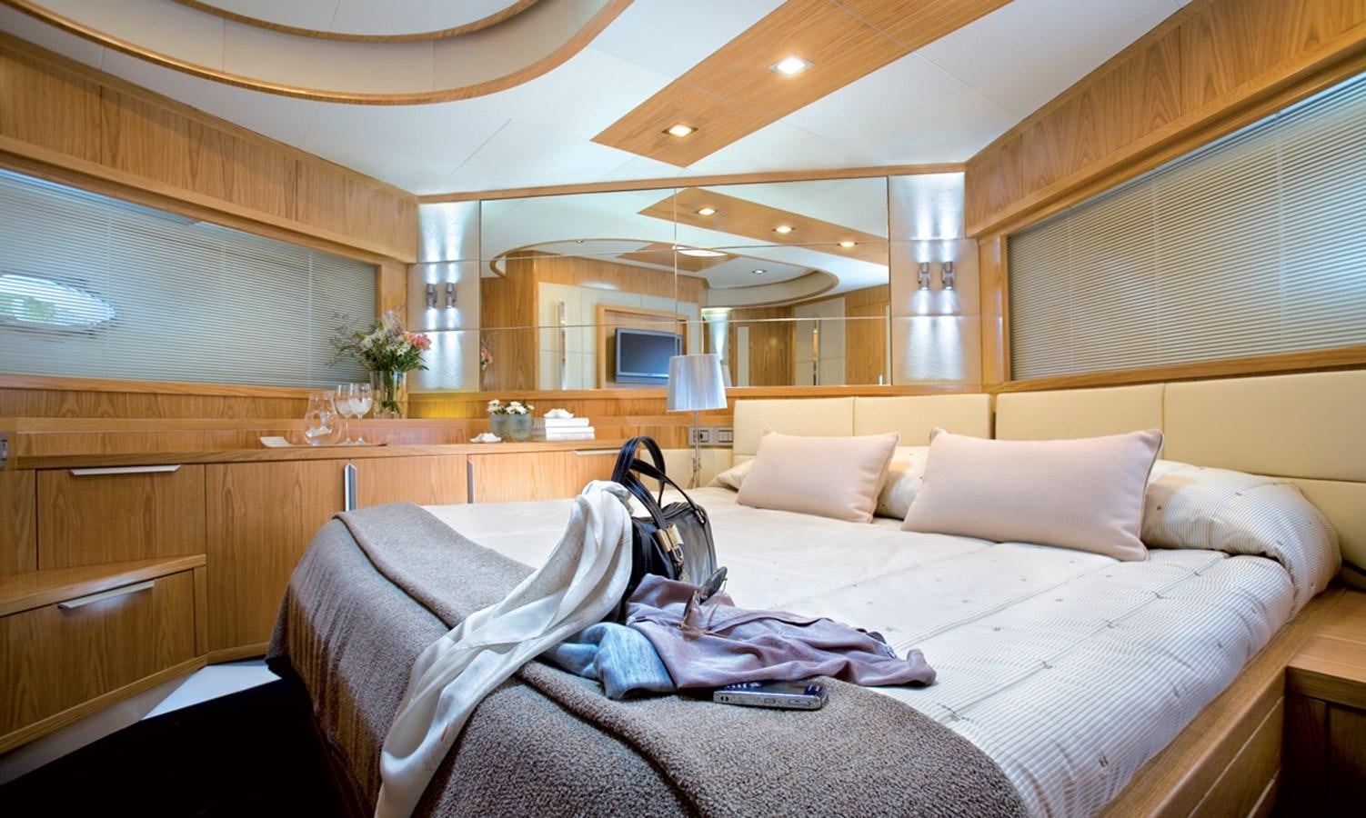 a bed with white sheets and pillows aboard RODMAN 74 MUSE Yacht for Sale