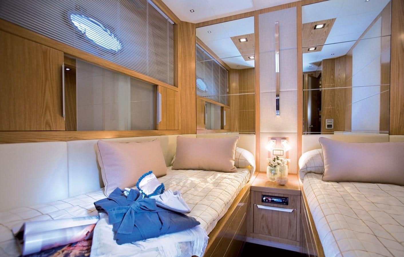 a room with a bed and a desk aboard RODMAN 74 MUSE Yacht for Sale