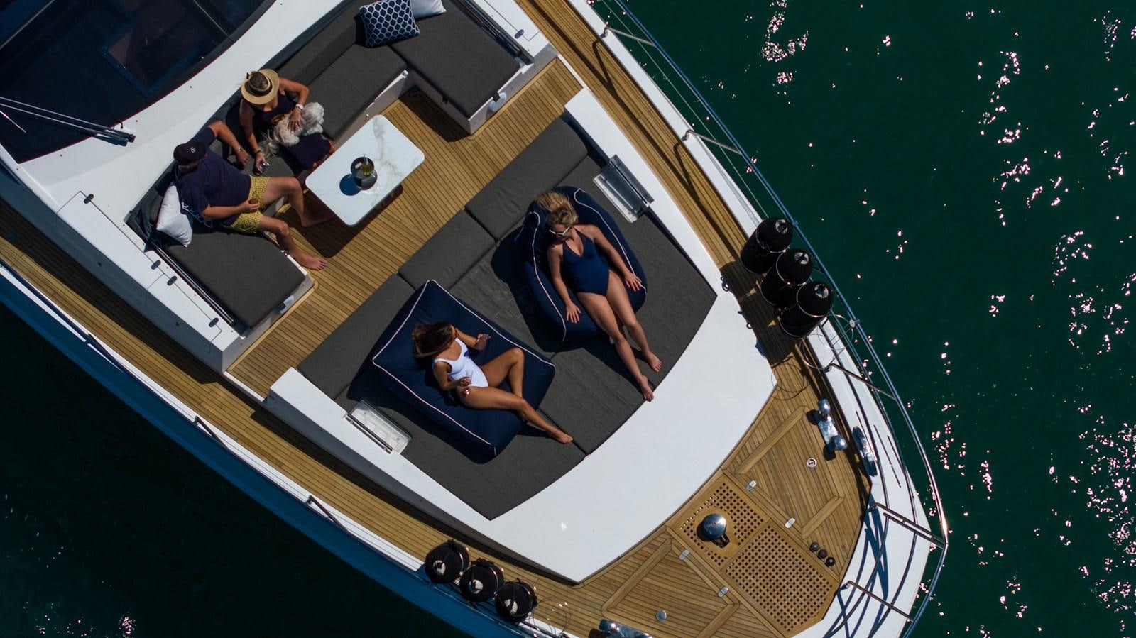 a group of people playing pool aboard SOLACE Yacht for Sale