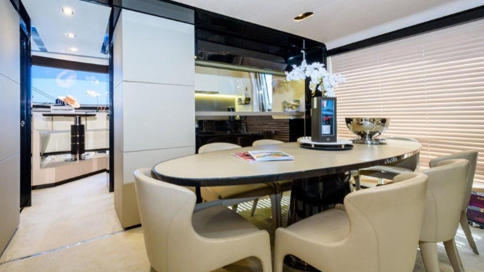 a room with a table chairs and a computer aboard SOLACE Yacht for Sale