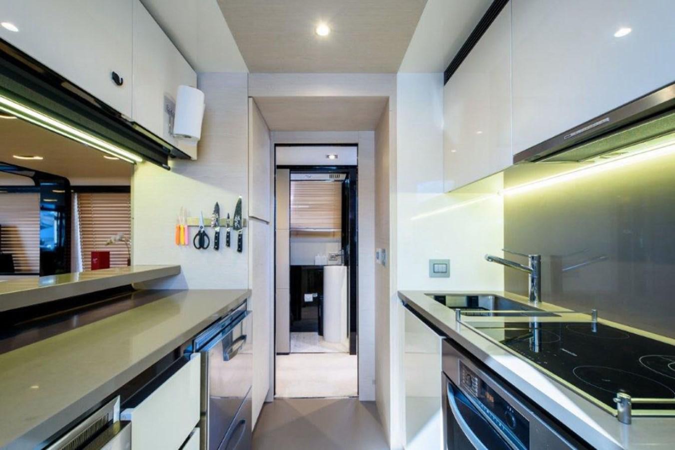a kitchen with a sink and a stove aboard SOLACE Yacht for Sale