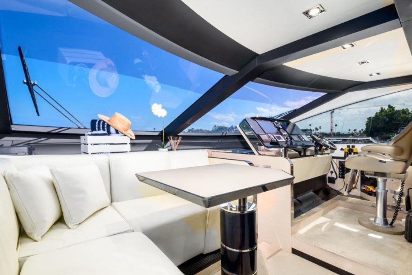 a room with a couch and a table and chairs aboard SOLACE Yacht for Sale