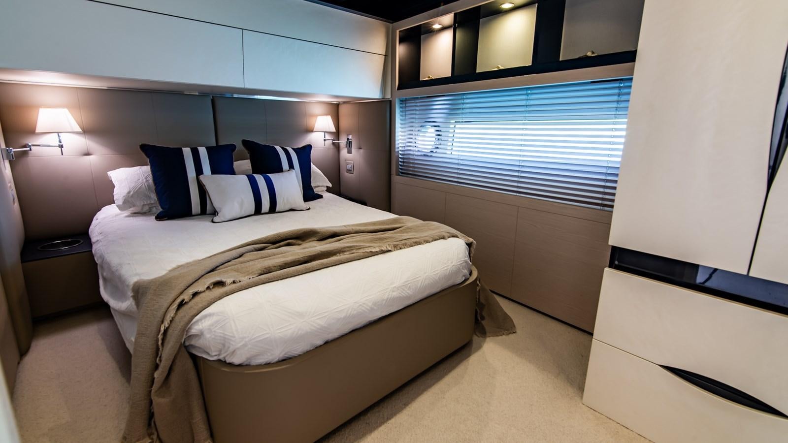 a room with a bed and a window aboard SOLACE Yacht for Sale