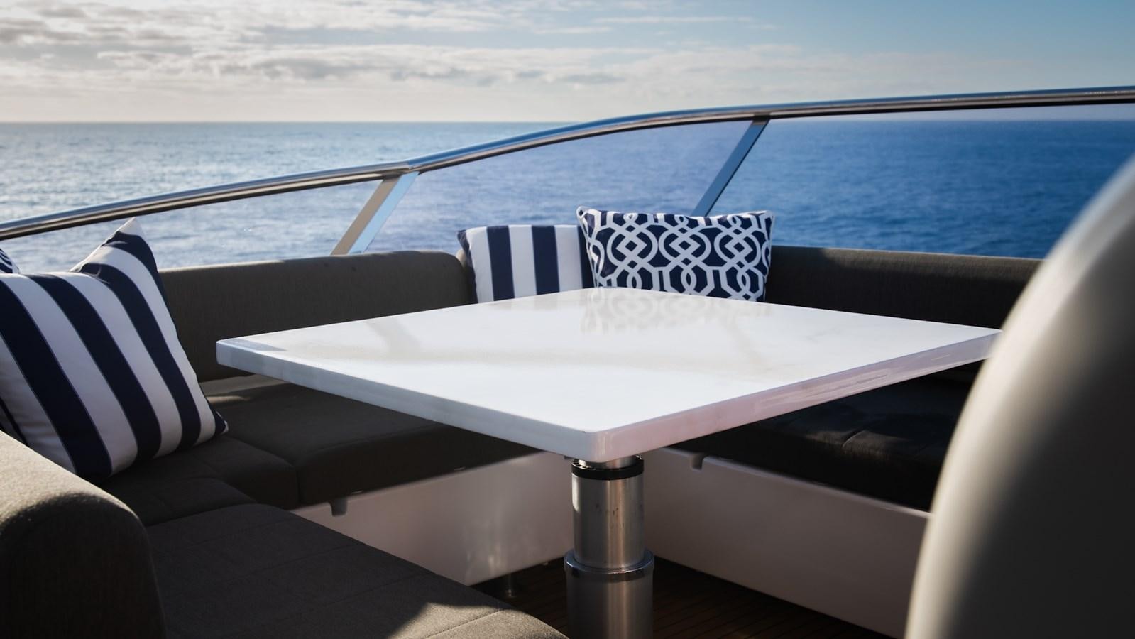 a table on a boat aboard SOLACE Yacht for Sale
