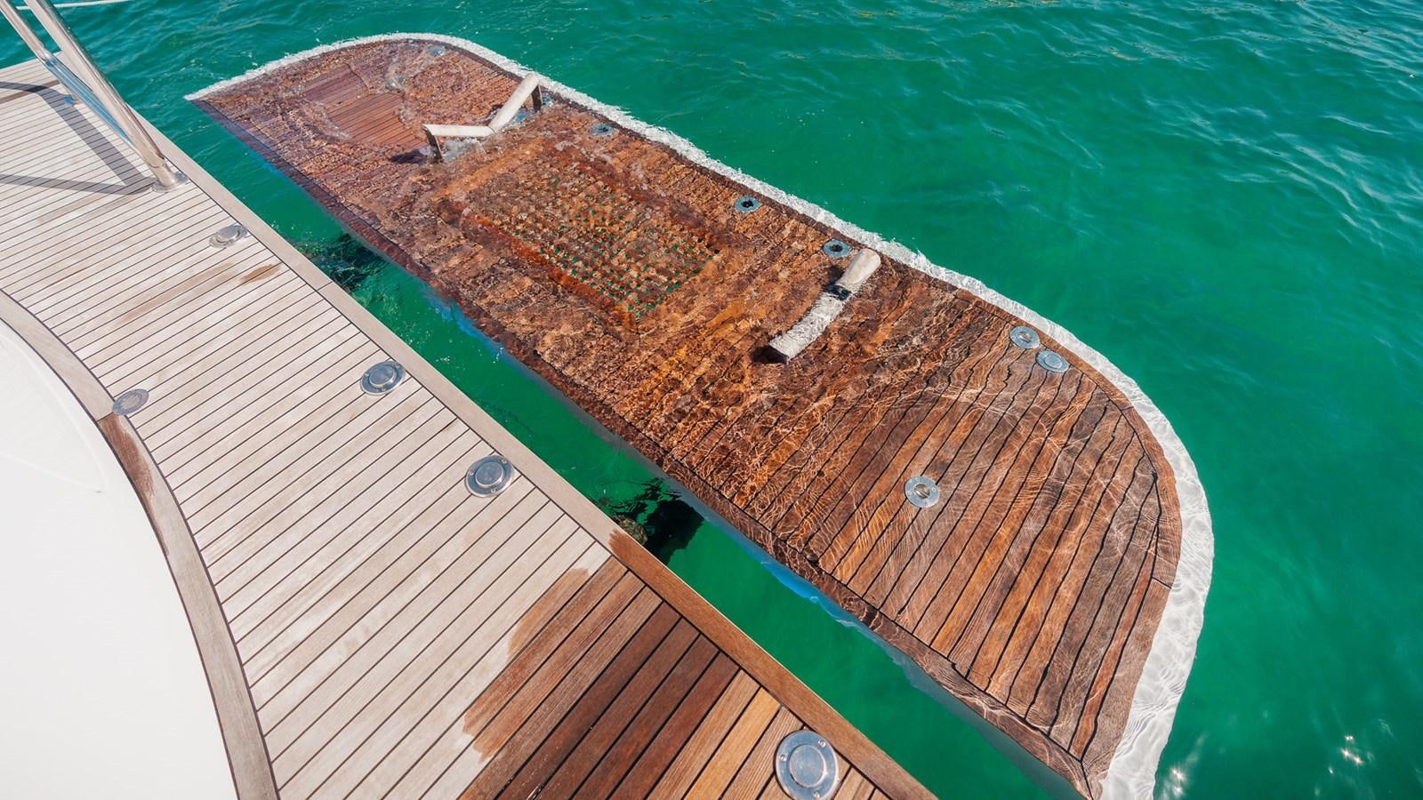 a wooden deck with a wooden deck aboard OHANA Yacht for Sale