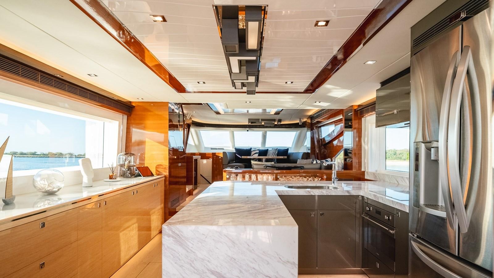 a large kitchen with a large island aboard OHANA Yacht for Sale