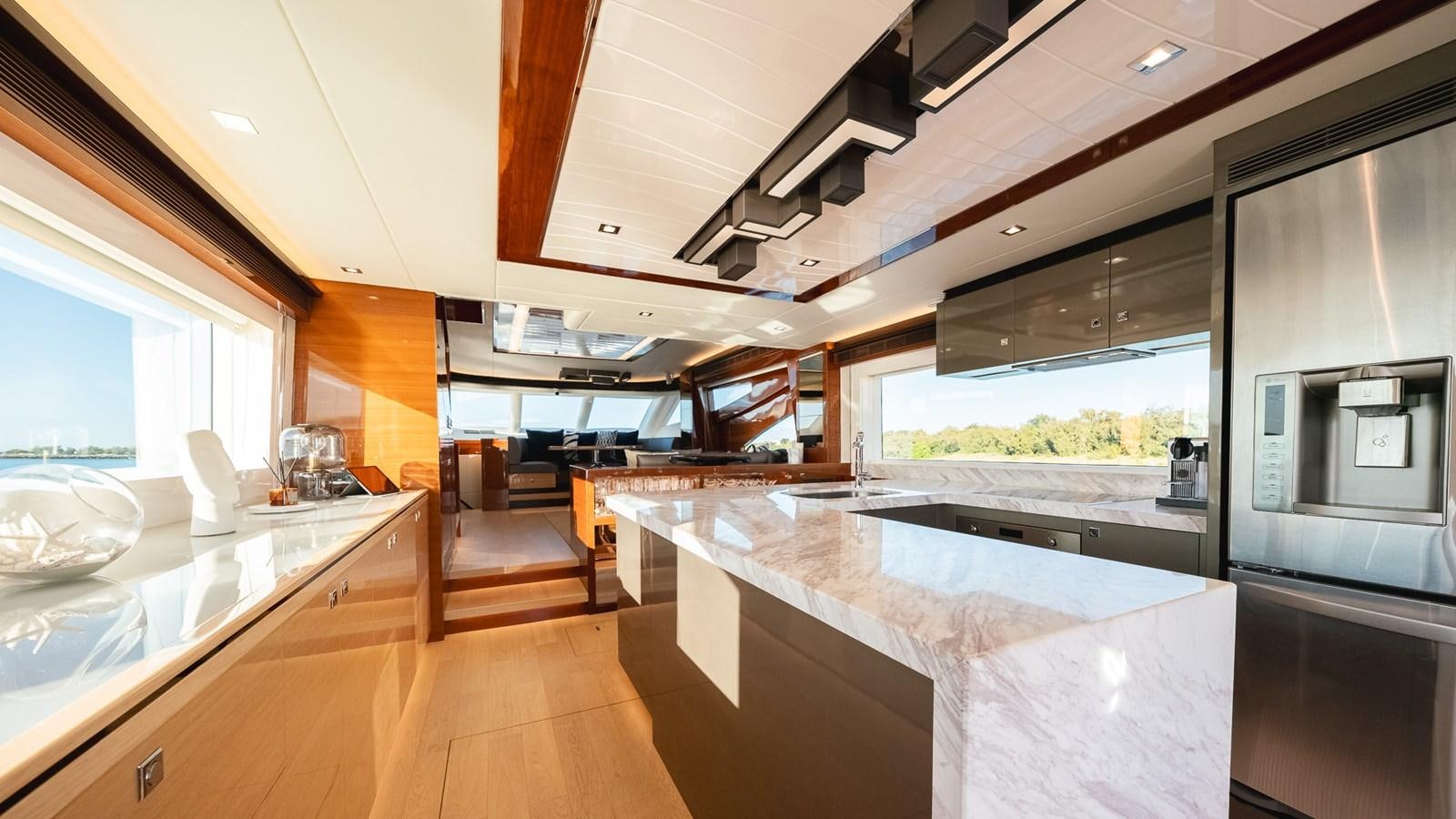 a kitchen with a large island aboard OHANA Yacht for Sale
