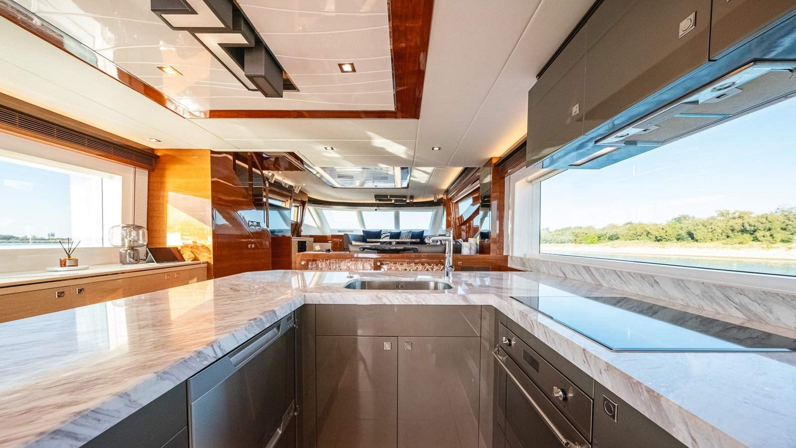 a kitchen with a large window aboard OHANA Yacht for Sale