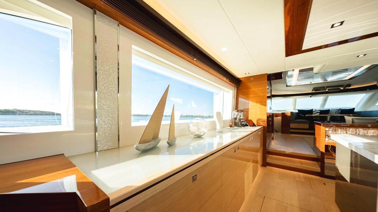 a large kitchen with a large window aboard OHANA Yacht for Sale