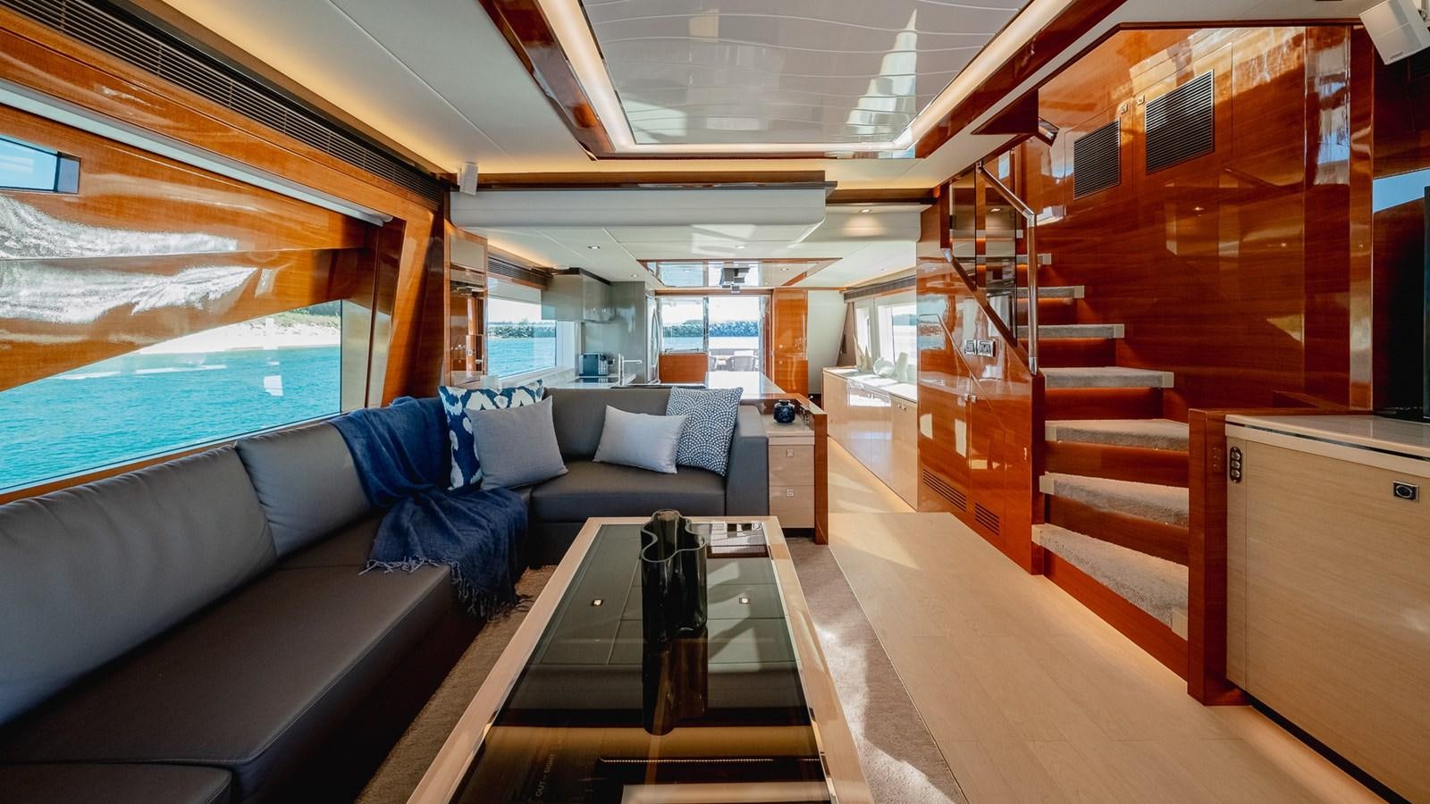 a room with a couch and a table aboard OHANA Yacht for Sale