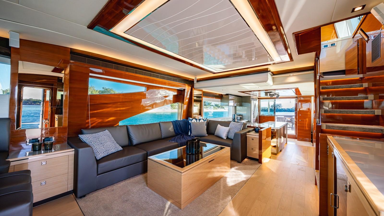 a living room with a large window aboard OHANA Yacht for Sale