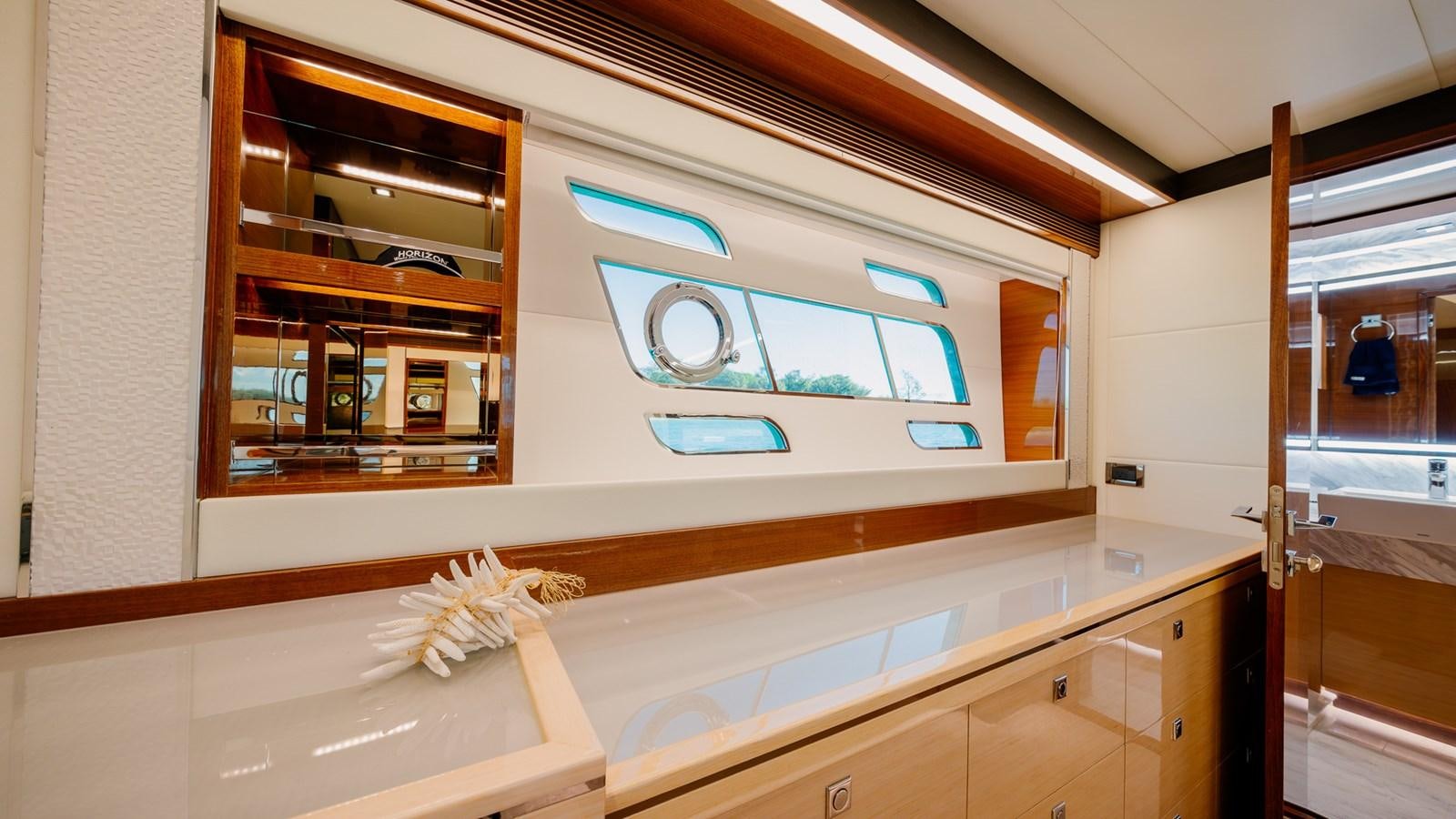 a kitchen with a glass door aboard OHANA Yacht for Sale