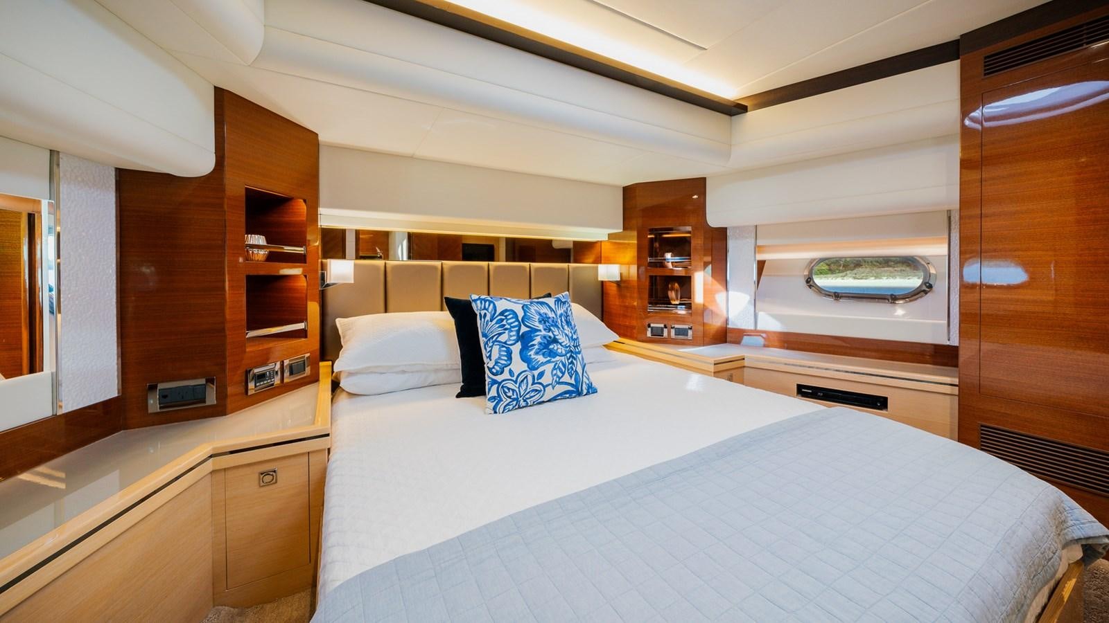 a room with a bed and a shelf aboard OHANA Yacht for Sale