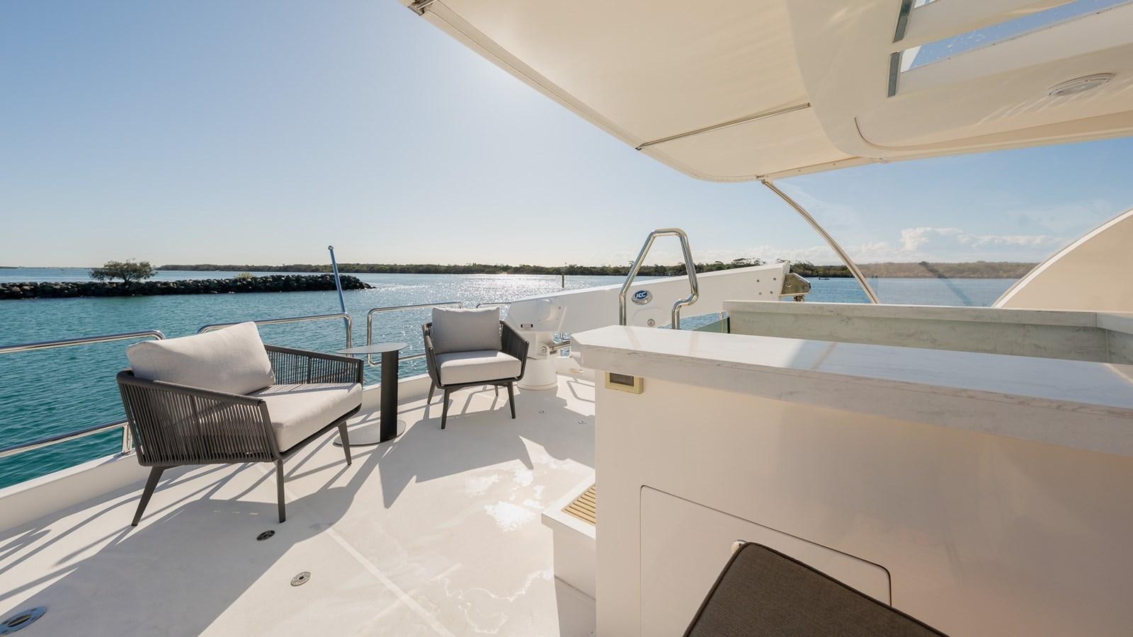 a lounge chair on a boat aboard OHANA Yacht for Sale